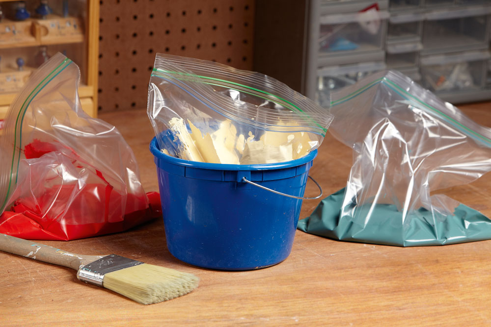 Decant paint into resealable plastic bags